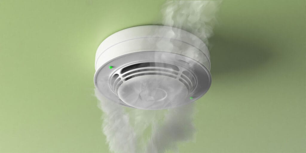 Smoke detector activating with visible smoke.
