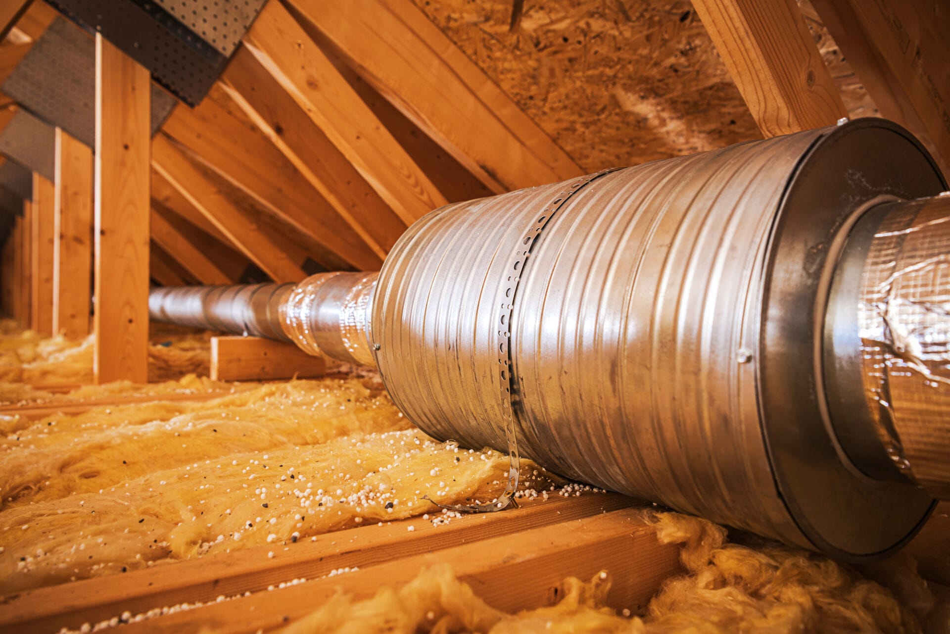 Attic insulation with air duct system.